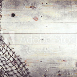 Fishing nets on wooden background. Still-life and objects.