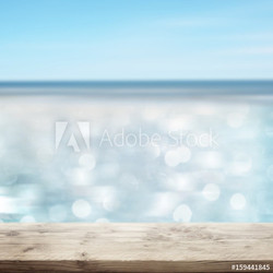 Glittering sea with wooden table