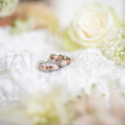 Romantic still life with wedding rings in vintage style