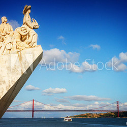 The Monument to the Discoveries in Lisbon and bridge of 25th April, Lisbon, Portugal, retro toned