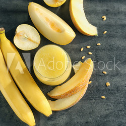 Composition with glass of fresh melon smoothie on table