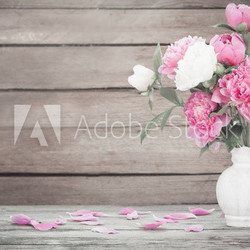 beautiful peony on old wooden background
