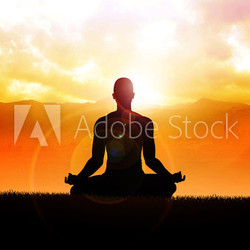 Silhouette of a man figure meditating in the outdoors