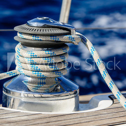 Sailing boat winch with rope closeup