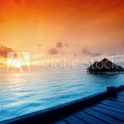 maldivian houses on sunrise