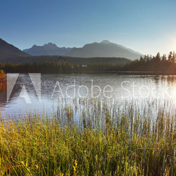 Sunset on mountain lake - Strbske pleso in Slovakia.