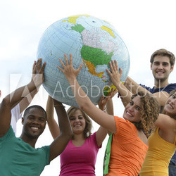 Group of young people holding a globe earth