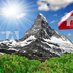Beautiful mountain Matterhorn with Swiss flag - Swiss Alps