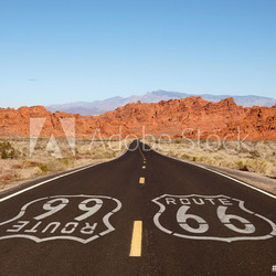 Route 66 Pavement Sign with Red Rock Mountains