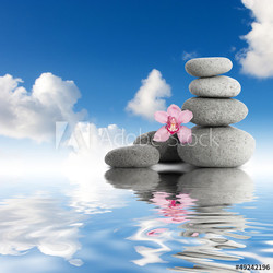Gray zen stones and orchid sky with clouds