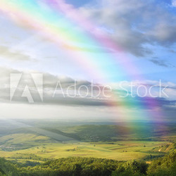 summer landscape with rainbow green hills and clear blue sky