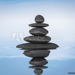 Zen stones balance in water concept 