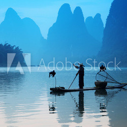 Chinese man fishing with cormorants birds, Yangshuo, Guangxi reg