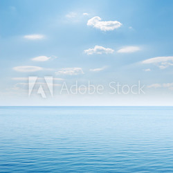 blue sea and cloudy sky over it