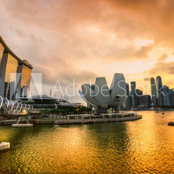 Singapore city skyline at sunset.