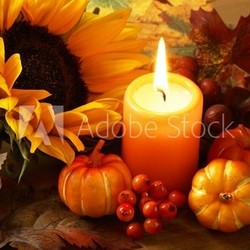 Arrangement of sunflower, candle and autumn decorations