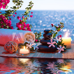 Candles - black stones and tiare - Bougainvillea on water