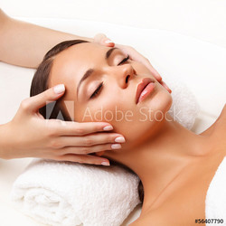 Face Massage.  Close-up of a Young Woman Getting Spa Treatment.