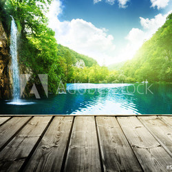 waterfall in deep forest of croatia and wood pier