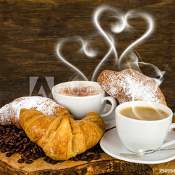 Croissants and coffee with heart- shaped steam