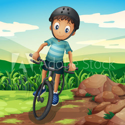 A kid biking at the hilltop