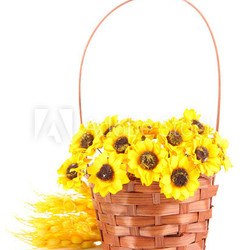 Bouquet of beautiful artificial flowers in wicker basket,