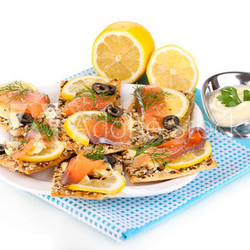 Salmon sandwiches on plate  isolated on white