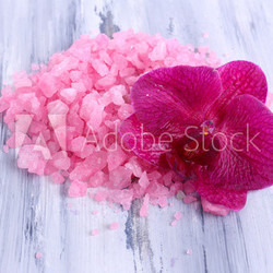 Beautiful blooming orchid flower  and heap of sea salt,