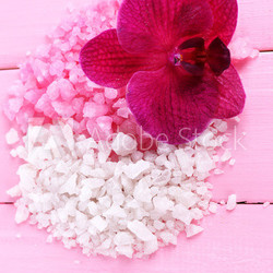 Beautiful blooming orchid flower  and heap of sea salt,