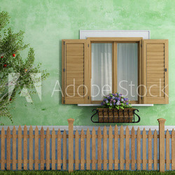 Old house with wooden fence and apple tree