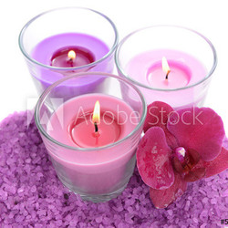 Beautiful colorful candles, orchid flower, sea salt isolated