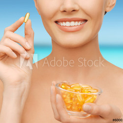 beautiful woman with omega 3 vitamins