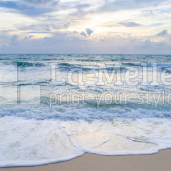 Beautiful wave on the beach at sunset