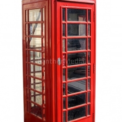 Classic red British telephone box.