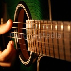 young woman strumming guitar