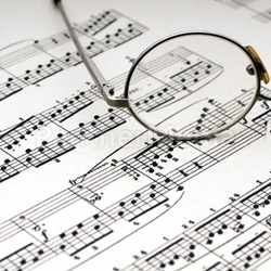 Reading glasses on sheet music
