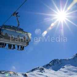 skiers in a chairlift