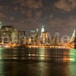 View of the Brooklyn Bridge in late evening, in panoramic format.