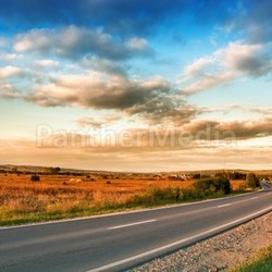 Rural road and blue sky with clouds