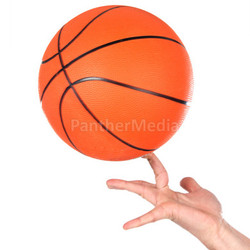 Hands making balancing with a basketball 