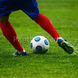 free kick on a green football field