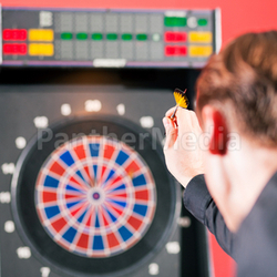 man playing darts