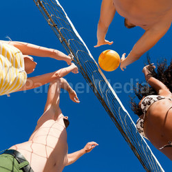 friends playing beach volleyball