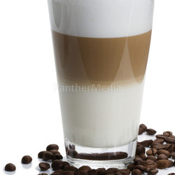 latte macchiato with coffee beans