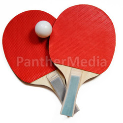 two table tennis racket with ball